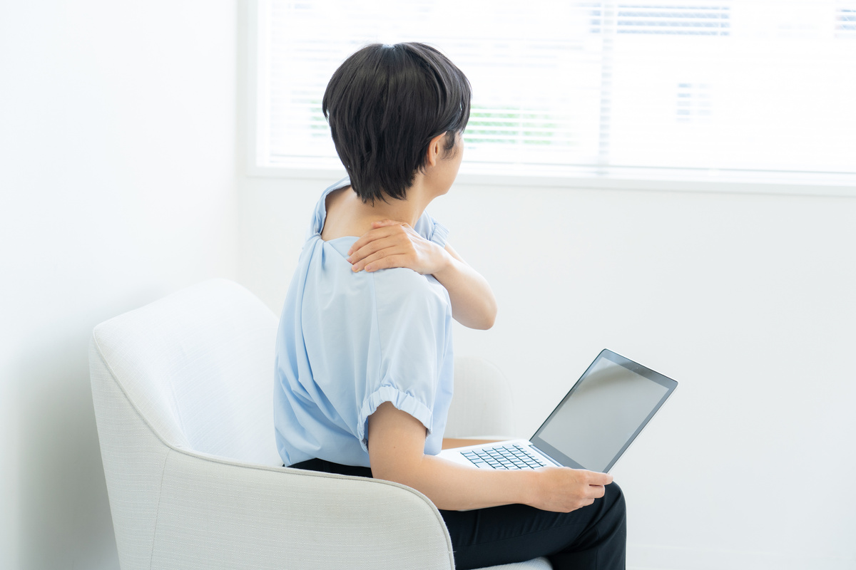 Woman suffering from stiff shoulders
